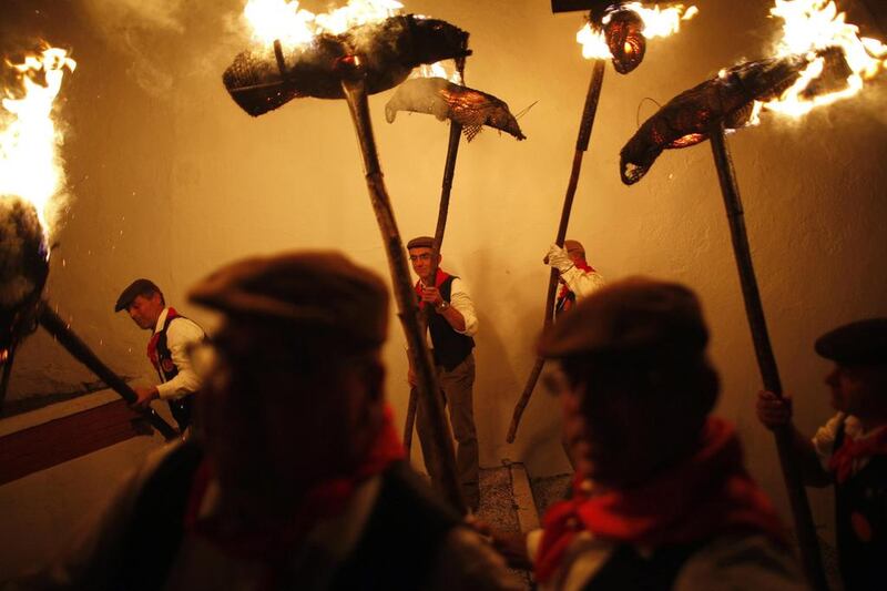 Villagers hold torches during the Divina Pastora procession, as part of a festival to honour the Virgin of Los Rondeles, in the southern Spanish village of Casarabonela late December. Jon Nazca / Reuters