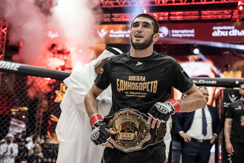 Amru Magomedov celebrates with the UAE Warriors lightweight title after a dominant win over Jakhongir Jumaev. Photo: UAE Warriors