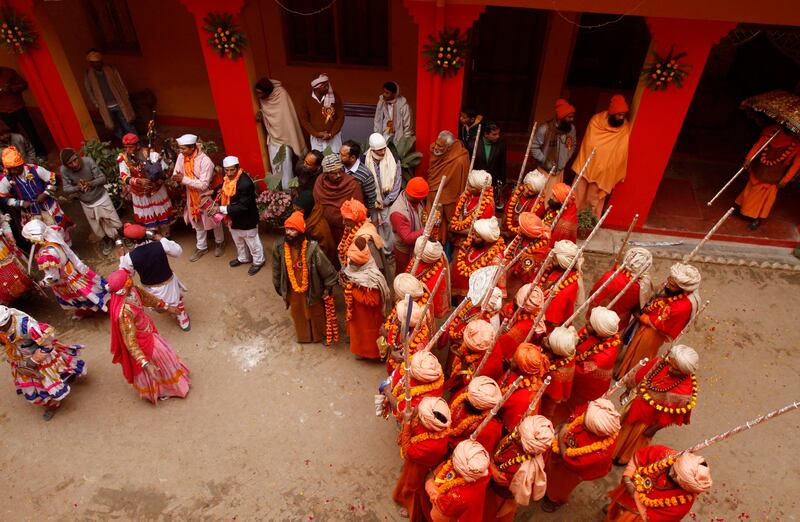 Sadhus, or Hindu holy men, prepare for a religious procession towards the Sangam, the confluence of rivers Ganges, Yamuna and mythical Saraswati, as part of the Mahakumbh festival in Allahabad, India, Sunday, Jan. 6, 2013. Millions of Hindu pilgrims are expected to take part in the large religious congregation on the banks of Sangam during the Mahakumbh festival in January 2013, which falls every 12th year. (AP Photo/Rajesh Kumar Singh) *** Local Caption ***  India Kumbh Festival.JPEG-0cd4d.jpg