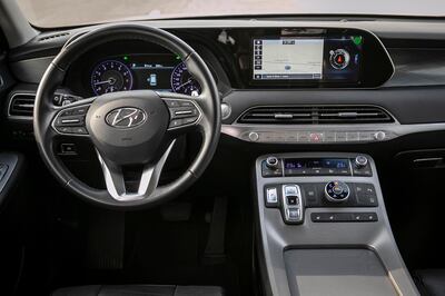 The range-topping Hyundai Palisade Premium comes with a 12-speaker Infinity sound system, 31-centimetre digital gauge cluster and 26cm infotainment touchscreen. Antonie Robertson / The National
