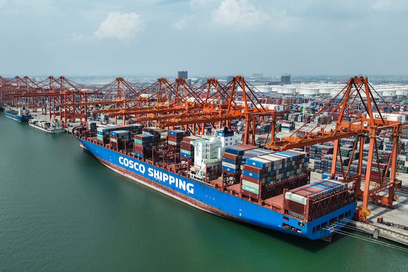 A container ship berthed at Qinzhou Port in China's Guangxi Zhuang Autonomous Region. China showed a strong increase in export levels last month, according to a new report. AP