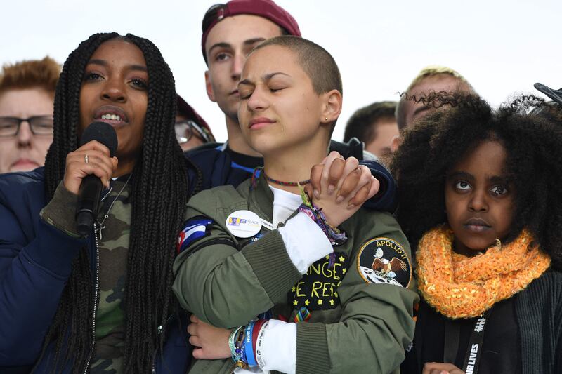 Marjory Stoneman Douglas High School student Emma Gonzalez listens with other students during the March for Our Lives Rally in Washington, in 2018. AFP