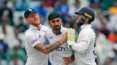 England's Shoaib Bashir, center, is congratulated by captain Ben Stokes, left and teammate Ben Foakes for taking the wicket of India's Rajat Patidar on the second day of the fourth cricket test match between England and India in Ranchi, India, Saturday, Feb.  24, 2024.  (AP Photo / Ajit Solanki)
