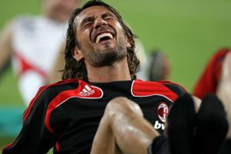 Paolo Maldini grimaces during training. The Italy legend retires after this season.