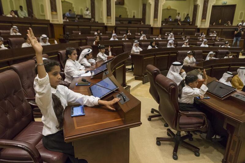 The 15th edition of the Sharjah Children Shura Council gets underway on April 26, 2017, at the Consultative Council of Sharjah building, with 11-year-old Alia Saif Hasan Al Marzouqi (front) raising  her hand with a question. Antonie Robertson / The National 