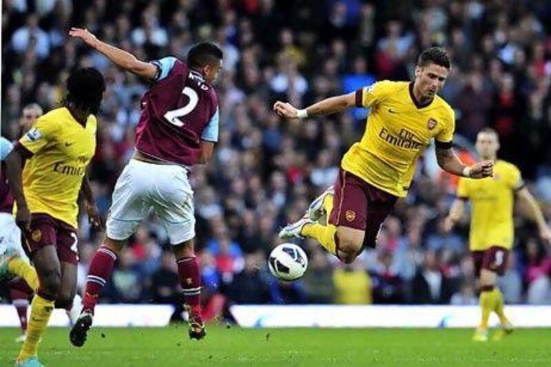 Olivier Giroud finally scored his first Premier League goal, against West Ham, as the Gunners won 3-1 at Upton Park. Glyn Kirk / AFP