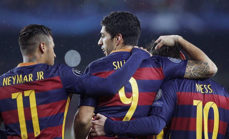 Neymar, Luis Suarez and Lionel Messi celebrate a goal in Barcelona's Champions League win over Arsenal on Wednesday night. Andreu Dalmau / EPA / March 16, 2016 