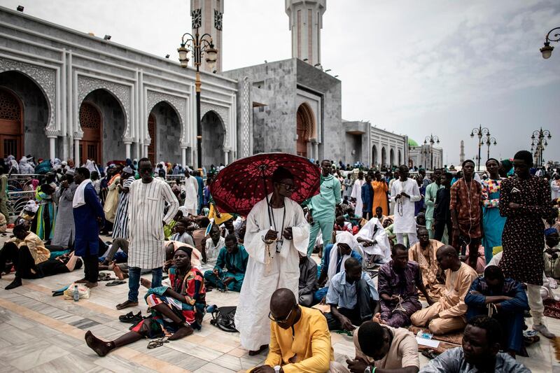 Worshippers are seen waiting in front of the Great Mosque of the Mourides  in Dakar, ahead of its inauguration.    AFP