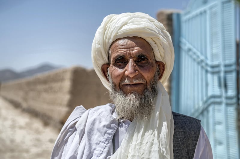 STRICTLY NO USE BEFORE 05:00 GMT (09:00 UAE) 18 JUNE 2020

“Here we have some problems but we’re happy because it’s our own country.”

Ninety-year-old returnee from Pakistan, Haji Sakhi Rahman, arrives at his home in Tarakhil Daag. After living as a refugee in Pakistan for 40 years he returned to Afghanistan four years ago. ; Tarakhail Daag is a suburb in east Kabul with limited access to government services like healthcare, education, and water. Daag, meaning desert, describes the barren landscape here. While the host community, returnees and internally displaced persons (IDPs) live adjacently, the groups generally have limited interaction. UNHCR’s prioritisation of the area for community-based protection projects aims in part to promote peaceful coexistence between different segments of the community, particularly as more returnees and IDPs are expected to settle here in the coming years. The refugee returnee community (1,100 families, or 7,150 individuals) who returned from Pakistan in 2016 are primarily (Pashtun) Kuchis, or of nomadic origin, from Baghlan and Kunduz provinces, who fled to Pakistan some 30 years ago. The security situation in those provinces forced families to settle in Tarakhail Daag on their return to Afghanistan. Many returnee families used UNHCR’s repatriation cash grant to buy land in Tarakhail Daag. Some 250 IDP families (1,625 individuals) also live in the area.