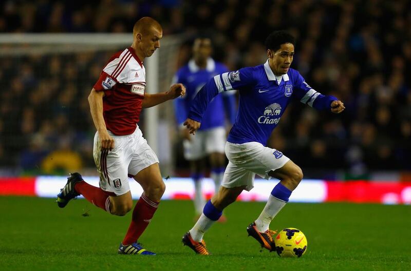 Steve Sidwell of Fulham, left, competes with Steven Pienaar of Everton during their match on Saturday. Paul Thomas / Getty Images