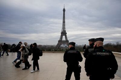 French gendarmes patrol near the Eiffel Tower after a man attacked passers-by in Paris. AP