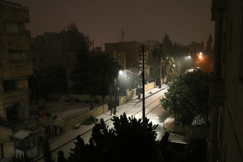 First winter snow falls in a deserted street in Amman, Jordan. According to local media news, snow was expected in areas from 900m and above. The Jordanian authorities announced on 16 January evening that government and private schools would not run the next day due to the weather conditions.  EPA