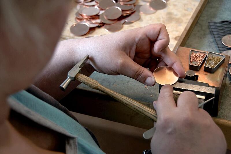 A watchmaker works on the dial of a timepiece. The brand has less than 20 people working on these luxury watches. Courtesy Atelier Laurent Ferrier
