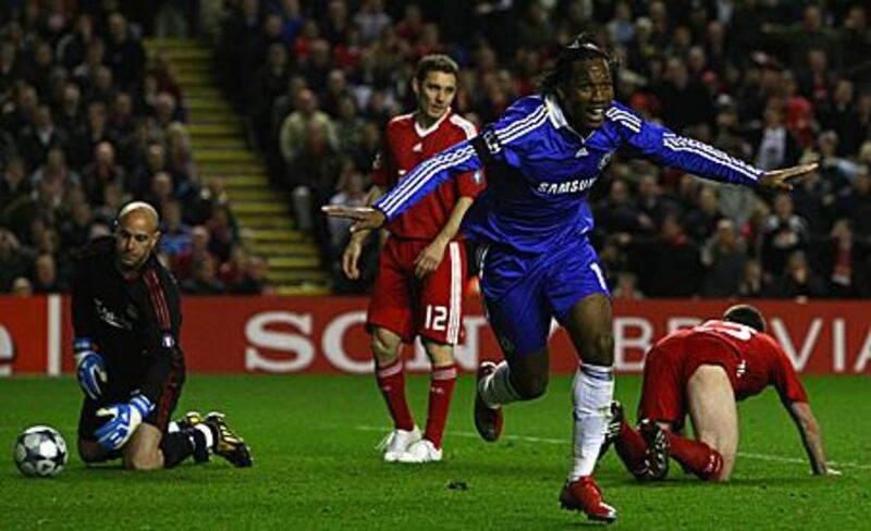 Didier Drogba of Chelsea celebrates scoring his team's third goal against Liverpool.