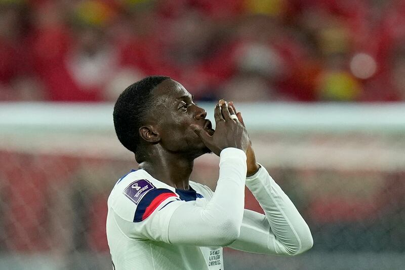 Tim Weah celebrates after scoring. AP