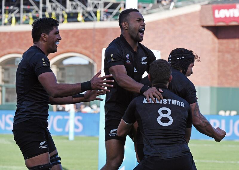 Members of the New Zealand men's rugby team celebrate after defeating England 33-12 in the Championships Final during the Rugby Sevens World Cup in the AT&T Park at San Francisco, California on July 22, 2018.  / AFP / Mark RALSTON
