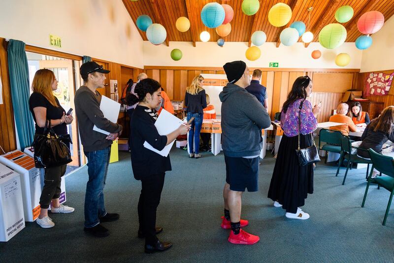 Voters stand in line at a polling station during the New Zealand General Election in Auckland, New Zealand. Bloomberg