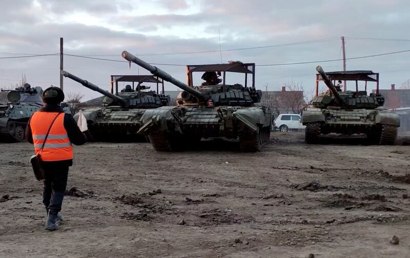 Russian military vehicles are loaded on to railway freight carriages in Crimea. EPA