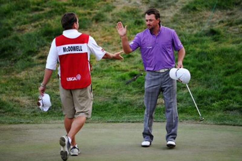 SAN FRANCISCO, CA - JUNE 16: Graeme McDowell of Northern Ireland and his caddie Ken Comboy celebrate a birdie on the 18th hole during the third round of the 112th U.S. Open at The Olympic Club on June 16, 2012 in San Francisco, California.   Stuart Franklin/Getty Images/AFP== FOR NEWSPAPERS, INTERNET, TELCOS & TELEVISION USE ONLY ==

