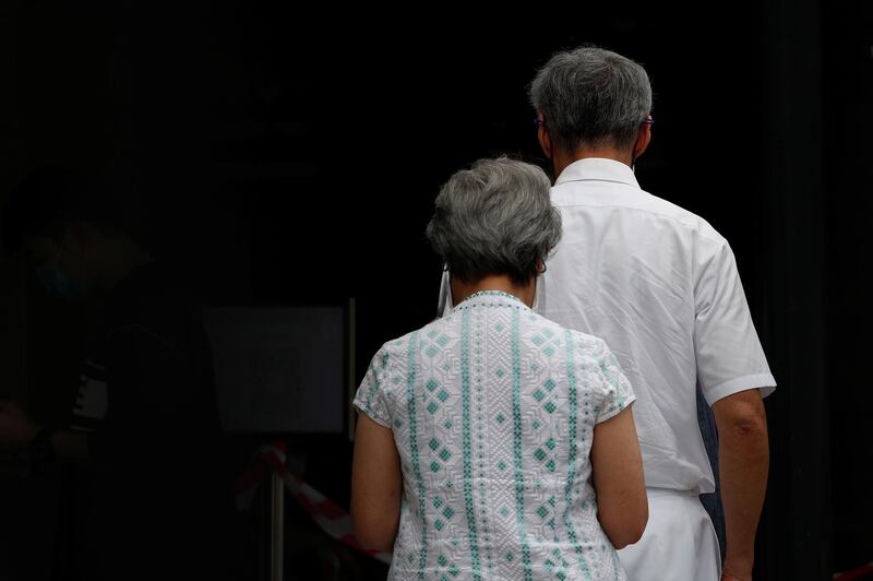 Singapore's Prime Minister Lee Hsien Loong and his wife Ho Ching arrive at a polling station during Singapore's general election. Reuters