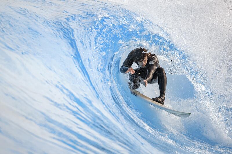 Surfer Vincent Schneider rides an artificial wave in the "Alaia Bay" wavepool in Sion, Switzerland, on Tuesday,  April 27. EPA