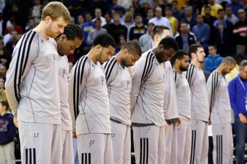 Members of the San Antonio Spurs' squad observe a moment's silence for victims of the Boston Marathon explosions.