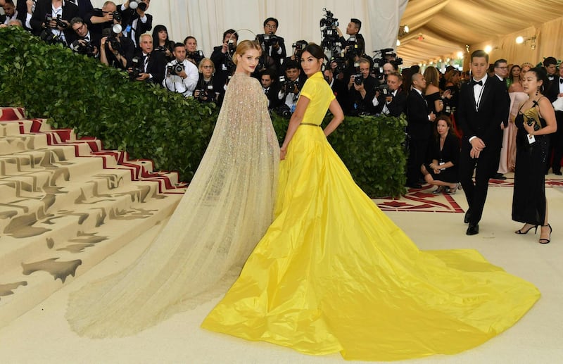 CORRECTION - Lily Aldridge (R) and Rosie Huntington-Whiteley arrive for the 2018 Met Gala on May 7, 2018, at the Metropolitan Museum of Art in New York.
The Gala raises money for the Metropolitan Museum of Art’s Costume Institute. The Gala's 2018 theme is “Heavenly Bodies: Fashion and the Catholic Imagination.” / AFP PHOTO / Angela WEISS / CORRECTION: “The erroneous mention[s] appearing in the metadata of this photo by Angela WEISS has been modified in AFP systems in the following manner: [Lily Aldridge] instead of [Gabrielle Union]. Please immediately remove the erroneous mention[s] from all your online services and delete it (them) from your servers. If you have been authorized by AFP to distribute it (them) to third parties, please ensure that the same actions are carried out by them. Failure to promptly comply with these instructions will entail liability on your part for any continued or post notification usage. Therefore we thank you very much for all your attention and prompt action. We are sorry for the inconvenience this notification may cause and remain at your disposal for any further information you may require.”