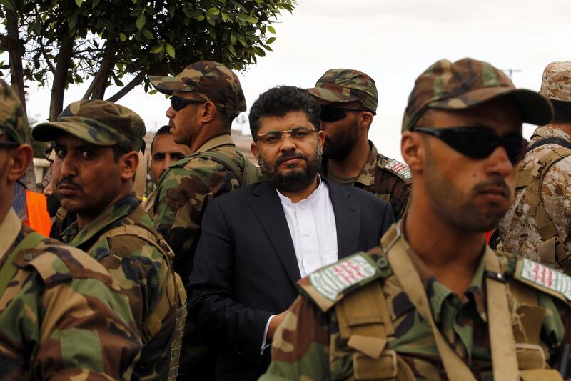 epa06711445 Houthi militiamen surround senior Houthi leader Mohammed Ali al-Houthi (C) during a solidarity rally for Palestinian people, in Sana'a, Yemen, 04 May 2018. According to reports, thousands of supporters of Houthi rebels staged an anti-Israel rally in Sana'a to show solidarity with Palestinians.  EPA/YAHYA ARHAB