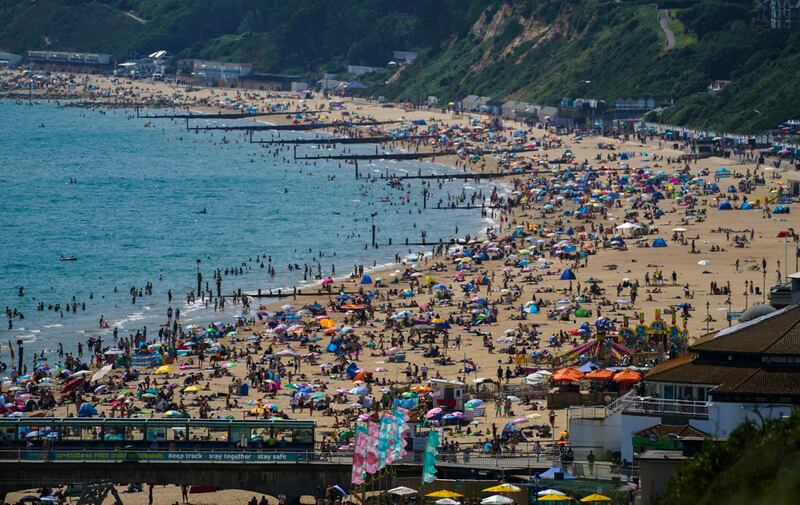 A packed beach in Bournemouth, England as people enjoy the warm weather.