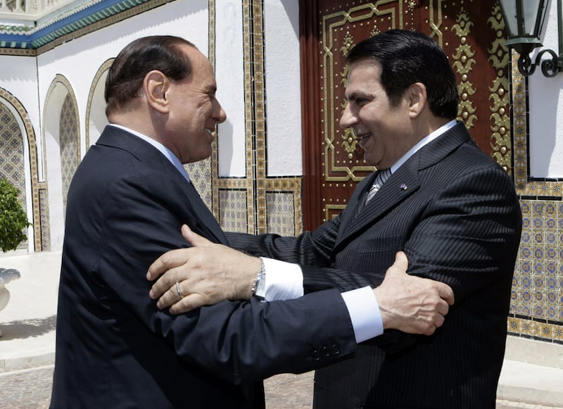 Former Tunisian president Zine El Abidine Ben Ali greets Mr  Berlusconi on his arrival in August 2009 at the presidential palace in Tunis.  AFP
