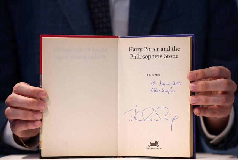 A rare first edition of 'Harry Potter and the Philosopher's Stone' signed by author JK Rowling on show at Christie's auction house in London. Reuters