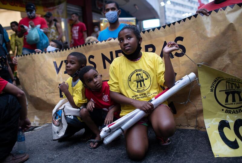 Children take part in a protest against racism and police violence during a "Black Lives Matter" demonstration  in Duque de Caxias, Brazil. AP Photo