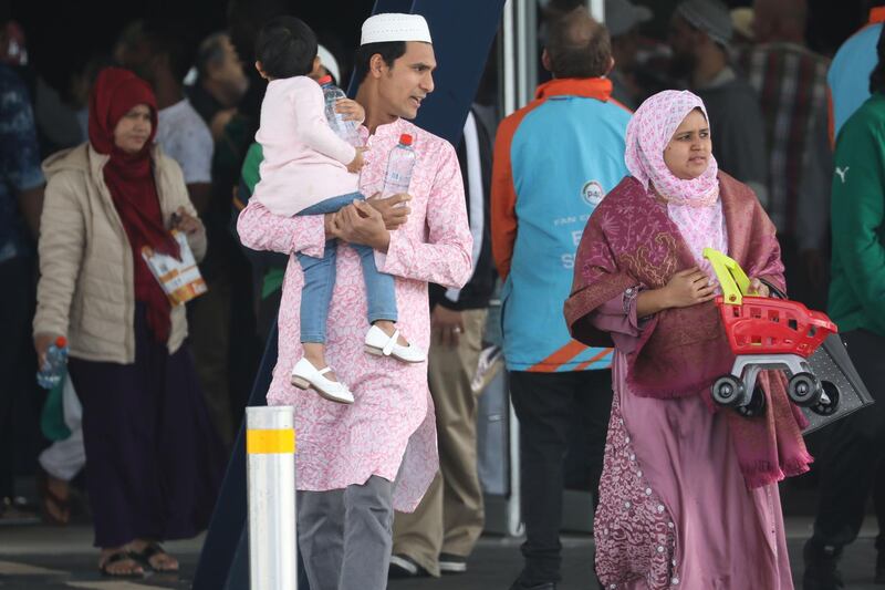 Members of the Muslim community leave Horncastle Arena after the prayer service. AFP