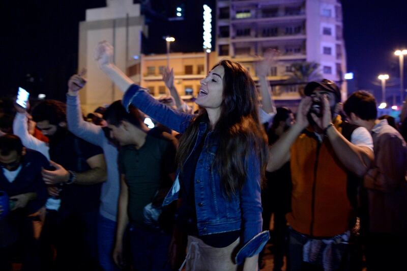 Protesters shout slogans as they block the main highway during ongoing anti-government protests near downtown in Beirut, Lebanon.  EPA