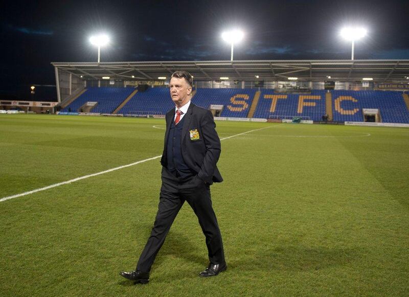 Manchester United's Dutch manager Louis van Gaal walks on the pitch ahead of the English FA Cup fifth round football match between Shrewsbury Town and Manchester United at the Greenhous Meadow stadium in Shrewsbury, western England on February 22, 2016. RESTRICTED TO EDITORIAL USE. No use with unauthorized audio, video, data, fixture lists, club/league logos or 'live' services. Online in-match use limited to 75 images, no video emulation. No use in betting, games or single club/league/player publications.  / AFP / OLI SCARFF / RESTRICTED TO EDITORIAL USE. No use with unauthorized audio, video, data, fixture lists, club/league logos or 'live' services. Online in-match use limited to 75 images, no video emulation. No use in betting, games or single club/league/player publications.