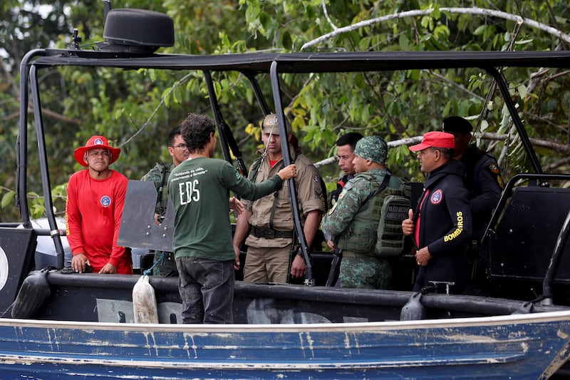 Brazilian police officers and rescue team members during the search operation for British journalist Dom Phillips and indigenous expert Bruno Pereira, who went missing in a remote and lawless part of the Amazon rainforest at Atalaia do Norte, Amazonas state, Brazil. Reuters