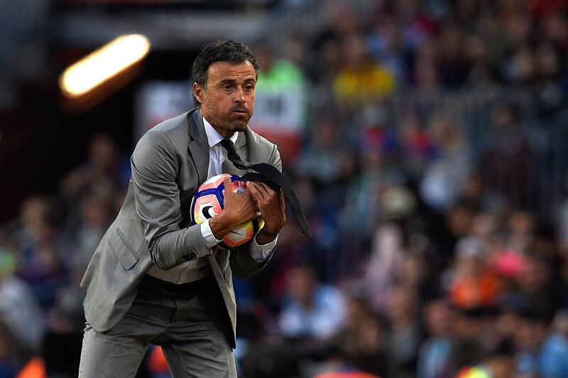 (FILES) In this file photo taken on May 21, 2017 Barcelona's coach Luis Enrique holds a ball during the Spanish league football match FC Barcelona vs SD Eibar at the Camp Nou stadium in Barcelona on May 21, 2017. The Spanish Football Federation named on July 9, 2018 former Barcelona coach Luis Enrique as Spain's new coach. / AFP / LLUIS GENE
