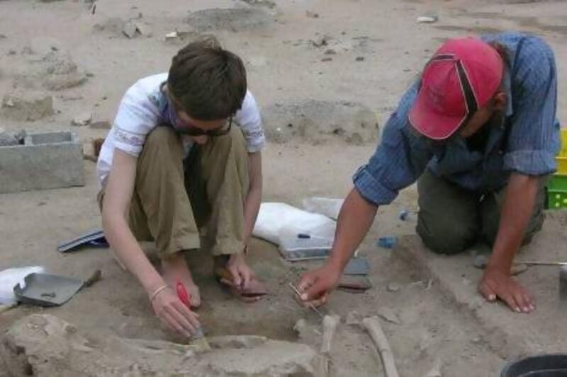 The archaeologist Adelina Kutterer, left, with a colleague working on an earlier excavation in Dibba al Hisn, Sharjah.