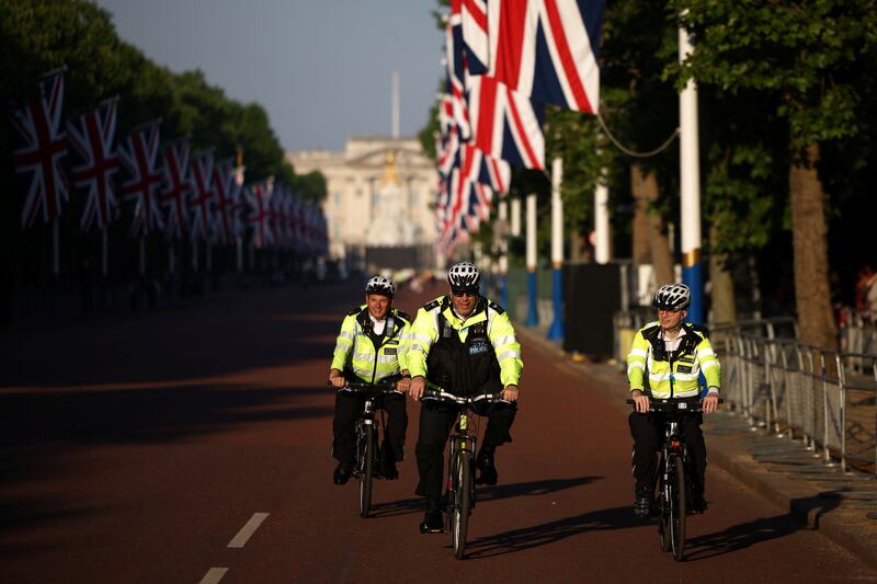 Police officers cycle down The Mall. Reuters