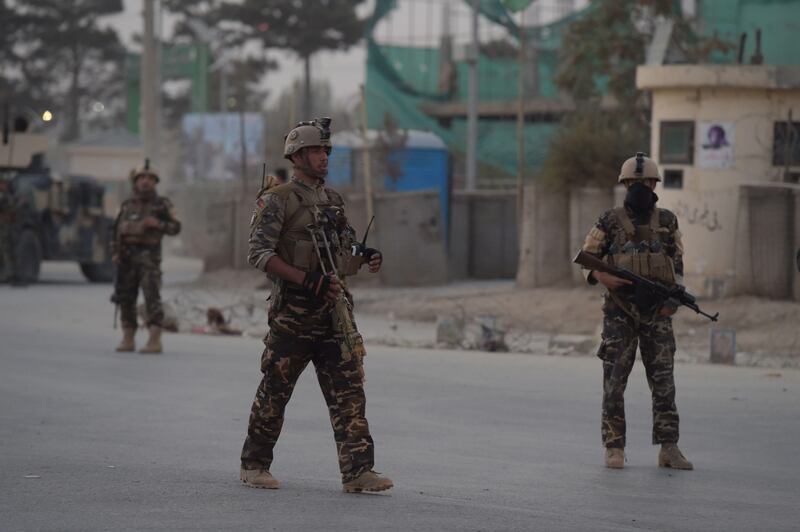 Afghan security personnel patrol near the site of a suicide bomb attack near the Marshal Fahim military academy base in Kabul on October 21, 2017.


A suicide bomber killed 15 Afghan army trainees as they were leaving their base in Kabul on Saturday, the defence ministry said, as militants step up their deadly attacks across the war-torn country. It was the second suicide bombing in the Afghan capital in 24 hours and the seventh major assault in Afghanistan since October 17, taking the total death toll to more than 200, with hundreds more wounded. / AFP PHOTO / WAKIL KOHSAR