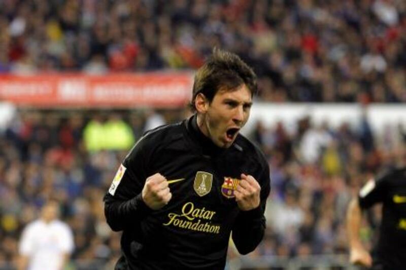 Barcelona's Lionel Messi celebrates a goal against Real Zaragoza during their Spanish First division soccer match at La Romareda stadium in Zaragoza, April 7, 2012. REUTERS/Albert Gea (SPAIN - Tags: SPORT SOCCER) *** Local Caption ***  BAR105_SOCCER-SPAIN_0407_11.JPG