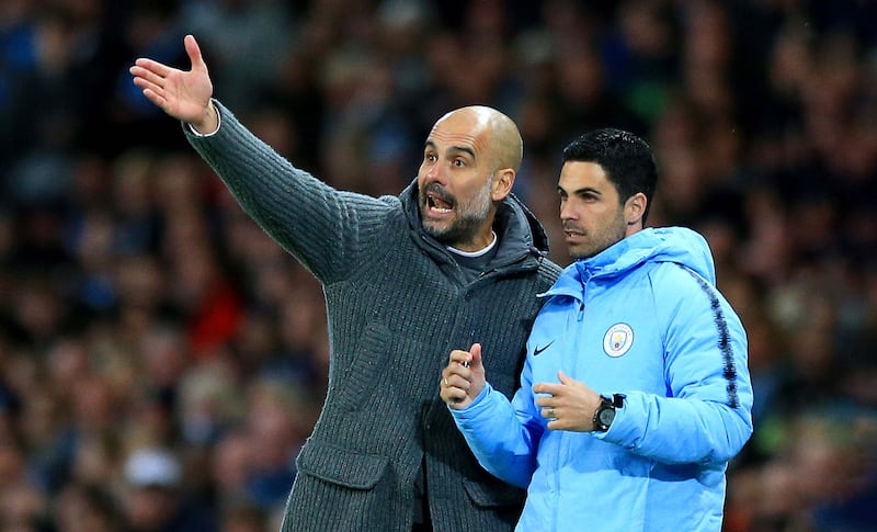 Manchester City manager Pep Guardiola, left, with his then assistant Mikel Arteta back in 2019. Getty