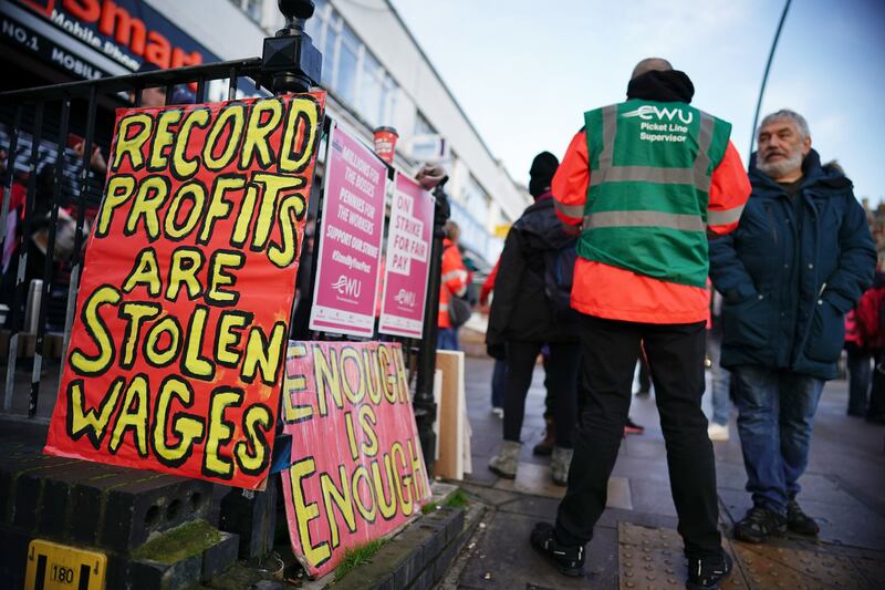Postal workers on the picket line at the Kilburn Delivery Office in north-west London. Members of the Communication Workers Union are holding a 48-hour strike in a long-running dispute over jobs, pay and conditions. PA