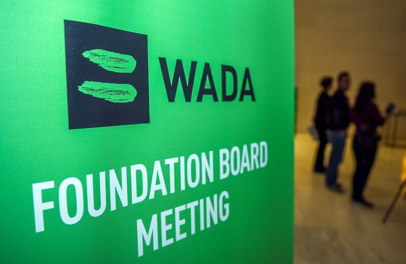 (FILES) In this file photo taken on November 15, 2018 Journalists stands in the lobby of the World Anti-Doping Agency (WADA) foundation board in Baku. The fight against doping was put to the test in 2018.  / AFP / TOFIK BABAYEV                   
