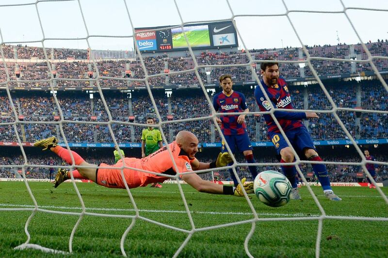 Eibar goalkeeper Marko Dmitrovic fails to stop Barceona's Lionel Messi scoring during their La Liga match on Saturday, February 22. Barca won the match 5-0 with Messi scoring four. AFP