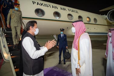  Saudi Crown Prince Mohammed bin Salman, right, welcomes Pakistan's Prime Minister Imran Khan at King Abdulaziz International Airport, Jeddah. Saudi Press Agency