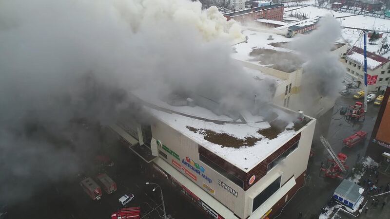 A still photo taken from video provided by Russian Emergencies Ministry shows a site of a fire at a shopping mall in Kemerovo, Russia. Russian Emergencies Ministry / Handout via Reuters