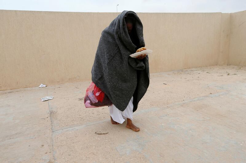 A migrant is seen after being rescued by Libyan coast guard near the western town of Sabratha, Libya. Reuters