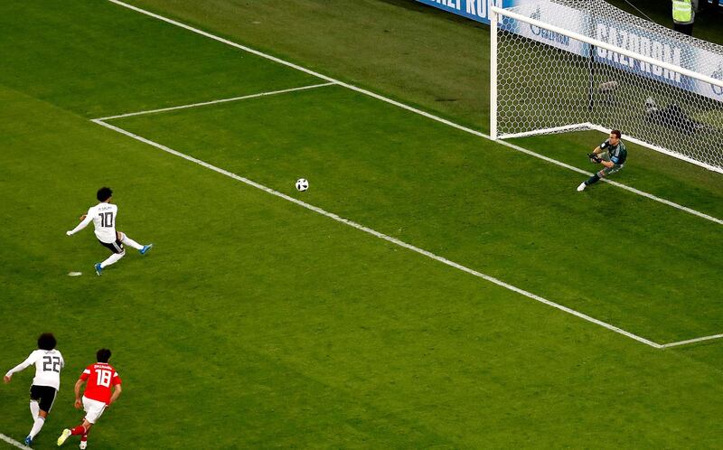 Mohamed Salah scores the penalty. Anatoly Maltsev / EPA