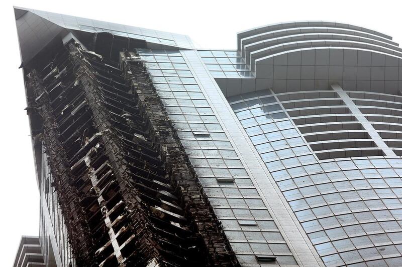 Damage to the residential Torch Tower in Dubai Marina after the fire was extinguished. Courtesy Warren Little / Getty Images